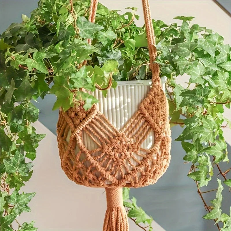 Khaki macrame hanger holding a white pot with trailing ivy