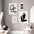 Two Quiet Lines prints beside a chair and curtain