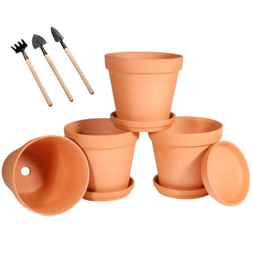 Four terracotta pots with saucers and mini planting tools
