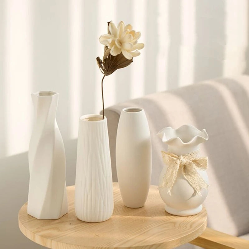 Two matte white vases on a wooden tray