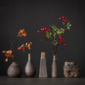 Small white ceramic bud vases