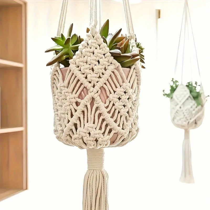 Close-up of the knotted cream macrame net pouch holding a terracotta pot